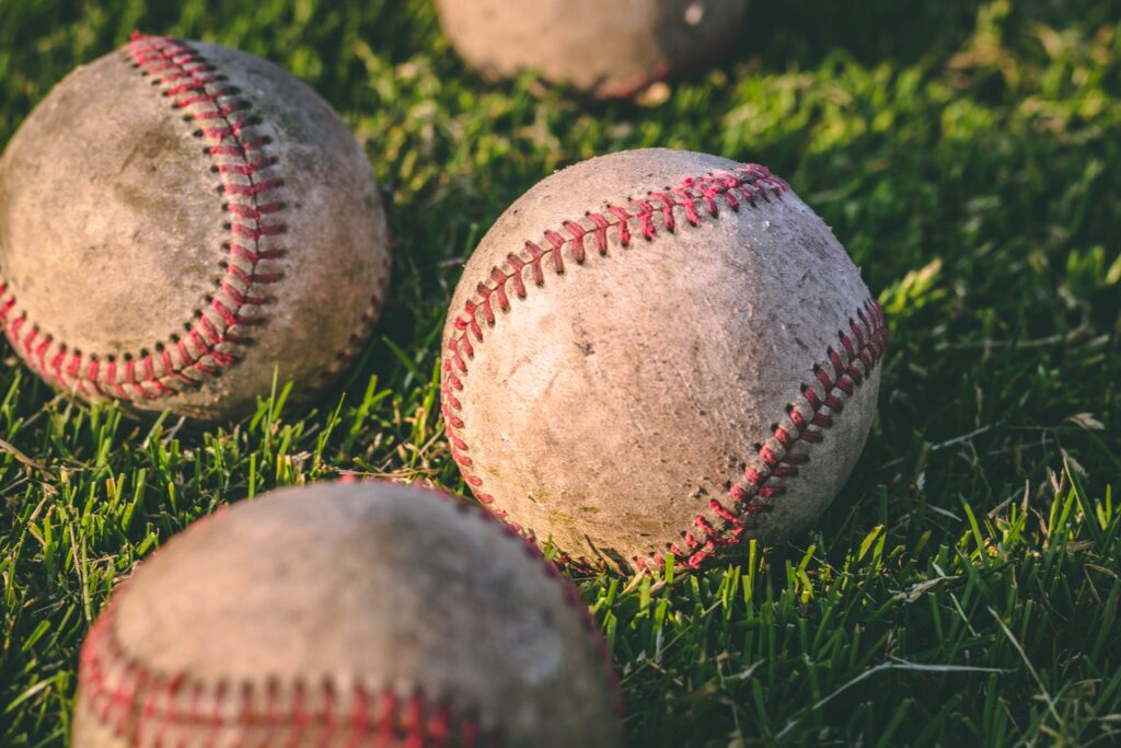 Baseballs in grass