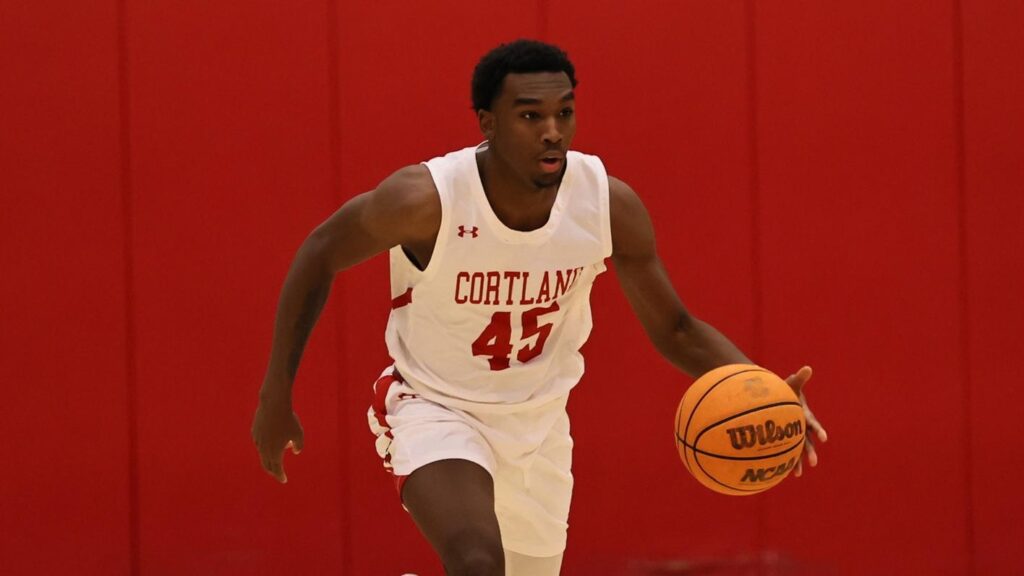 Freshmen guard Gerrad Beaubrun (45) dribbling down the court in win against Oneonta.