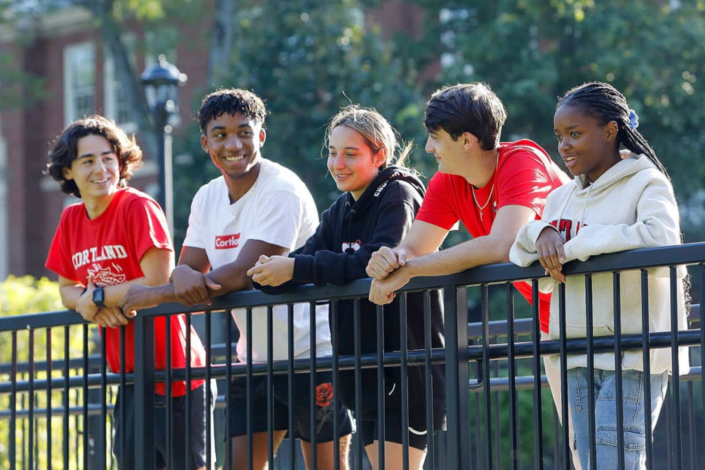 5 students talking outside