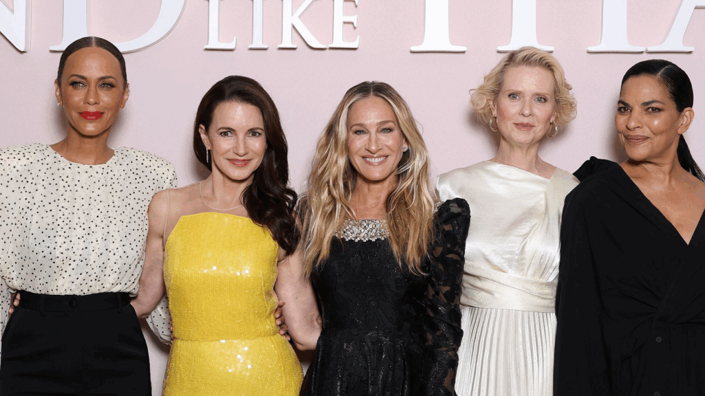 Five women from the cast of And Just Like That... posing at an event.