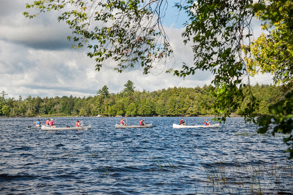 SUNY Cortland students canoeing on Raquette Lake