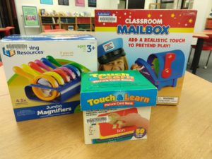 Three hands on activity samples from the TMC collection: Jumbo Magnifiers, Touch & Learn Picture Card Bank, and a play Classroom Mailbox